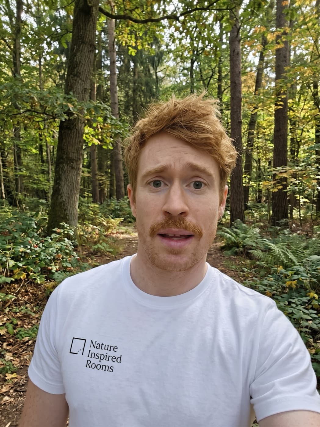 Kevin, founder of Nature Inspired Rooms, standing in woodland